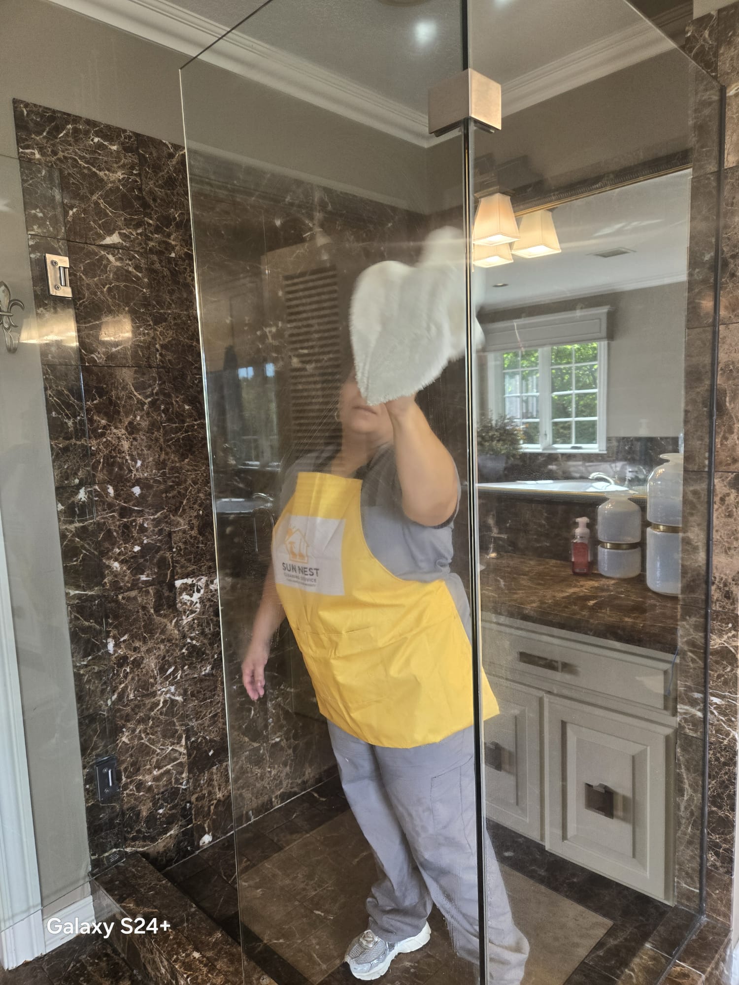 Sun Nest team professionally cleaning a luxury bathroom